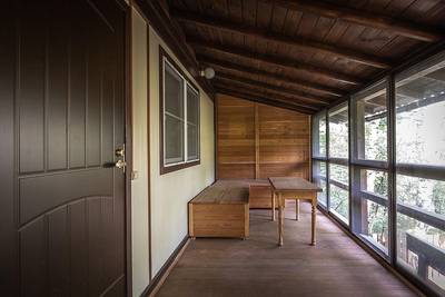 Second floor veranda. Materials: larch, aluminum profile, sandwich panels and glass with polymer coating